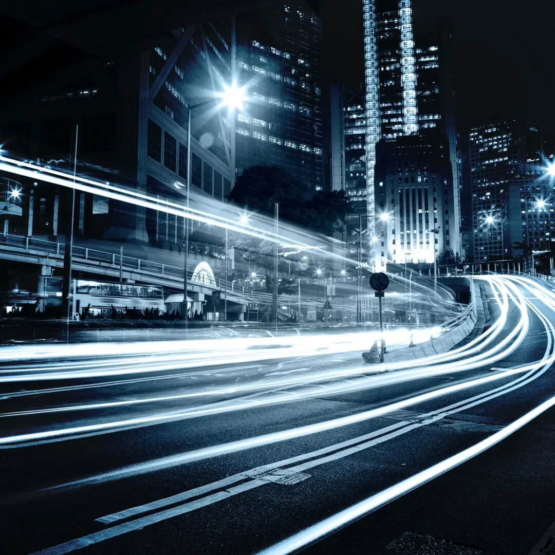 Roads and buildings in a city in the night