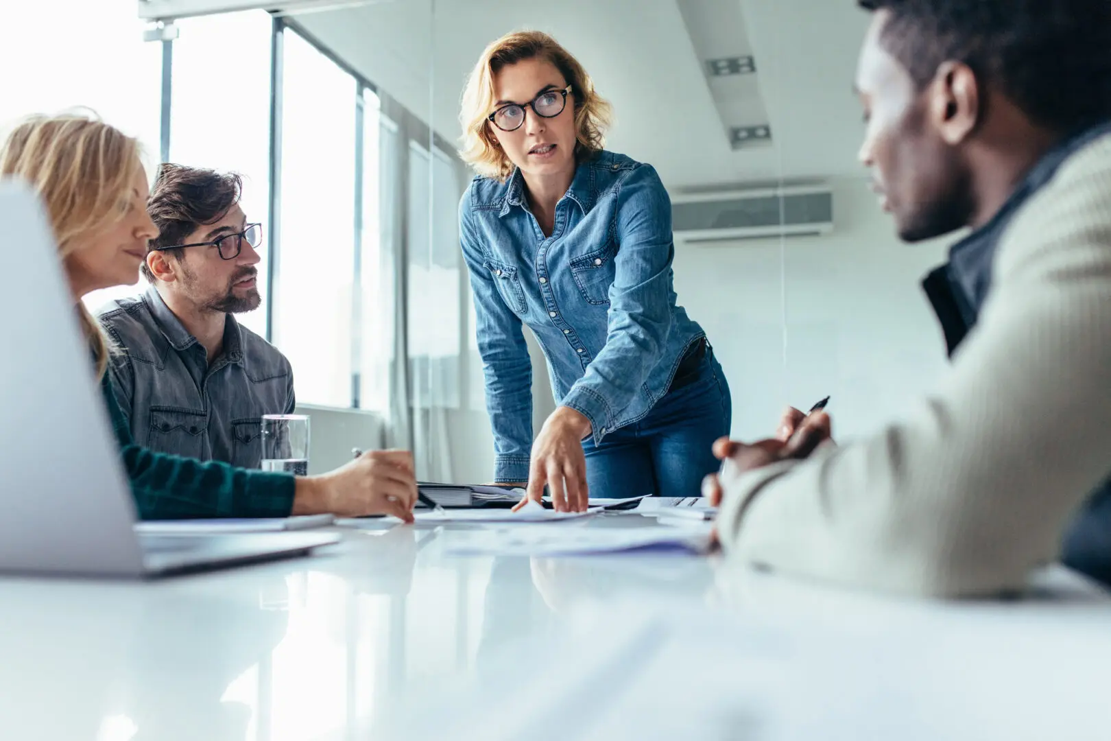 a woman explaining a point in a meeting